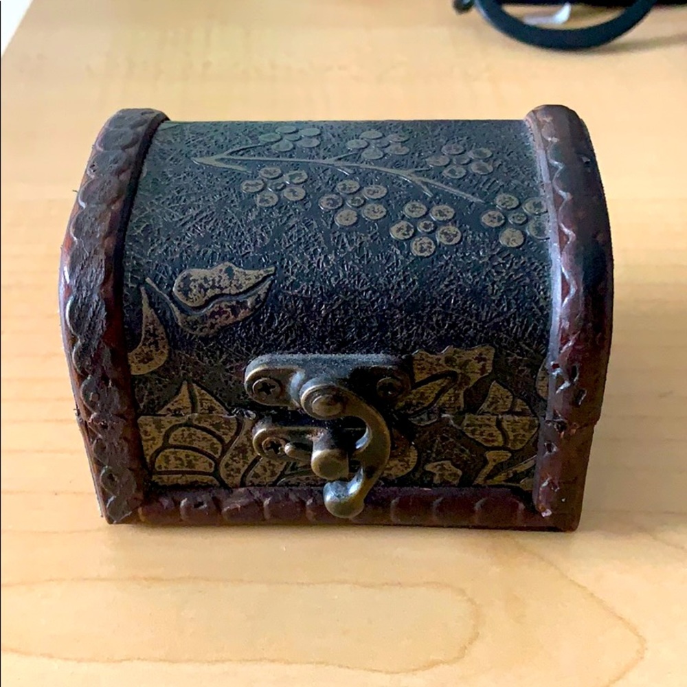 Small wooden jewelry box with metal latch